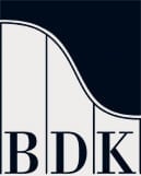 BDK logo featuring stylized letters on a dark background with curved design element
